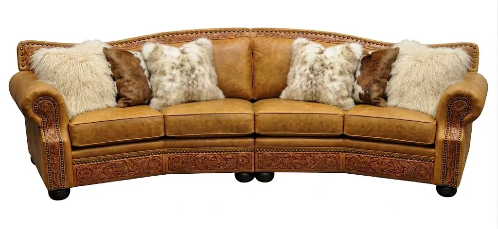 Cartwright-leather-conversation-sofa-fur-pillows.webp
