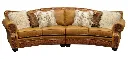 Cartwright-leather-conversation-sofa-fur-pillows.webp